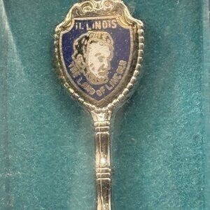 4 silver plated collectors spoons